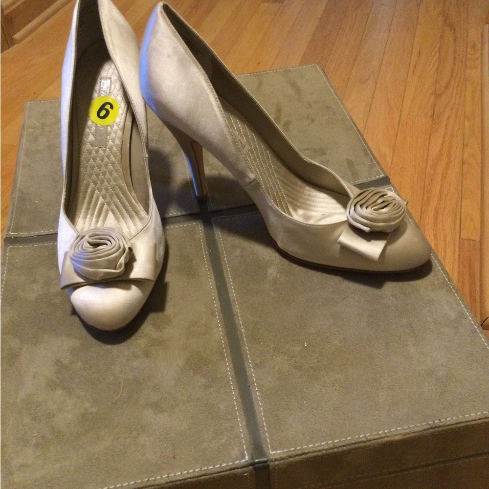 Etienne Aigner satin pumps.